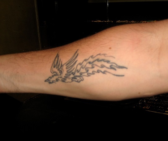 mike's right forearm showing his tattoo of a phoenix